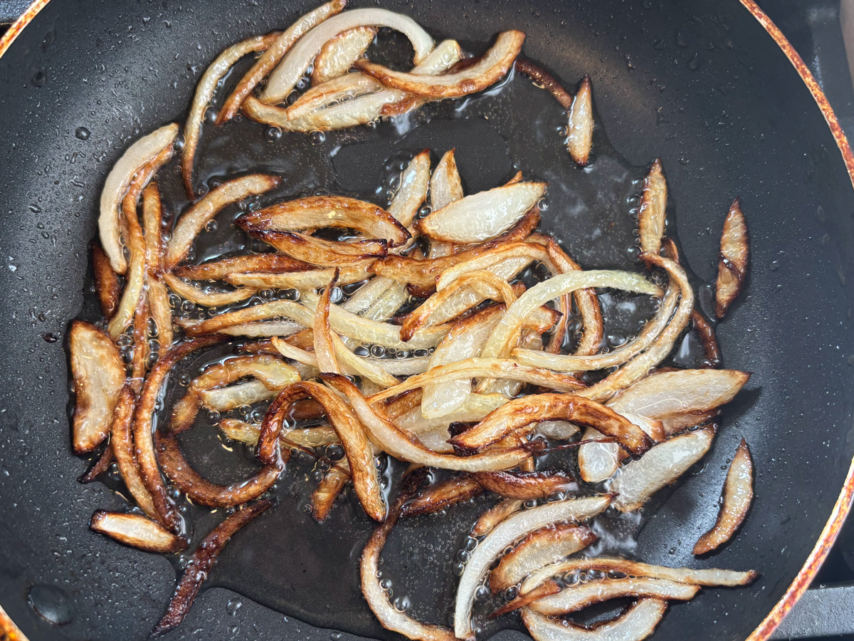 Browning the onion in a frying pan