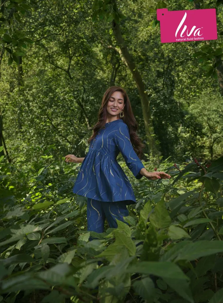 Image may contain Plant Vegetation Clothing Coat Jungle Nature Outdoors Land Tree Woodland Face Head and Person