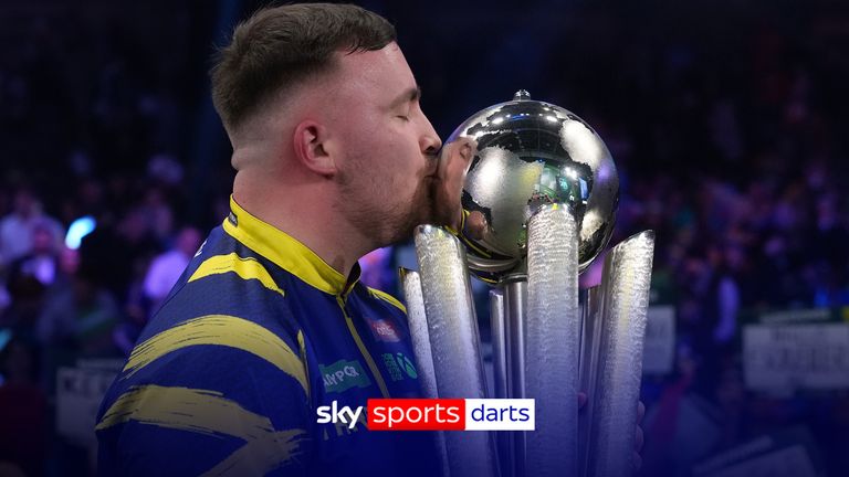 England's Luke Littler kisses the trophy after winning the World Darts Championships final match against Gian van Veen of the Netherlands at Alexandra Palace in London, Saturday, Jan. 3, 2026.