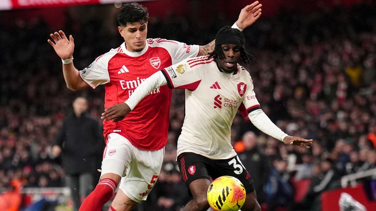 Arsenal's Piero Hincapie (left) and Liverpool's Jeremie Frimpong battle for the ball