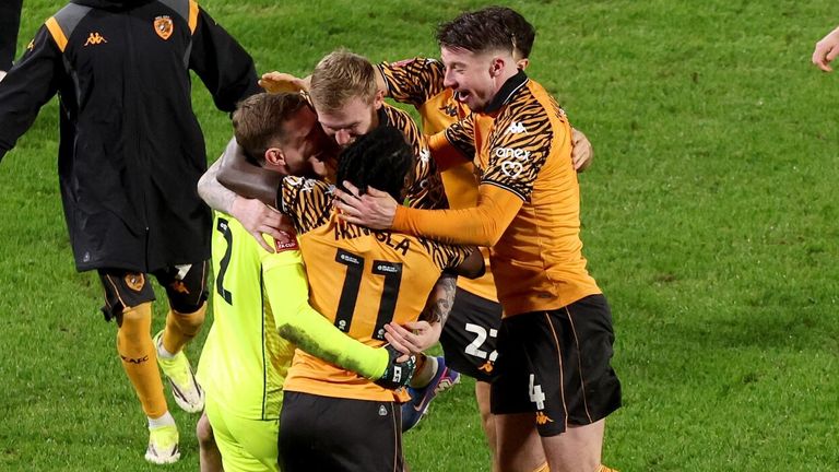 Goalkeeper Dillon Phillips is mobbed by his team-mates after Hull beat Blackburn on penalties to advance to the FA Cup fourth round