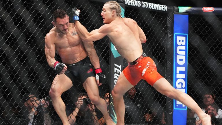 Michael Chandler, left, and Paddy Pimblett battle during a mixed martial arts fight at UFC 314, Sunday, April 13, 2025, in Miami. (AP Photo/Lynne Sladky)