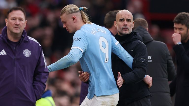 Pep Guardiola embraces Erling Haaland as he comes off in the second half