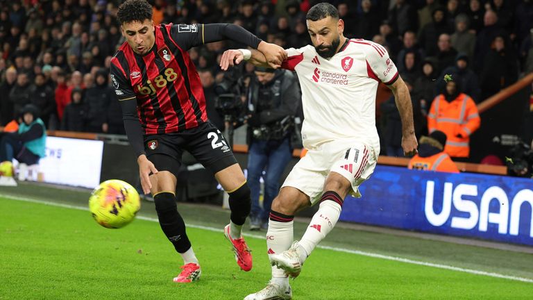 Mohamed Salah gets a cross into the Bournemouth box under pressure from James Hill
