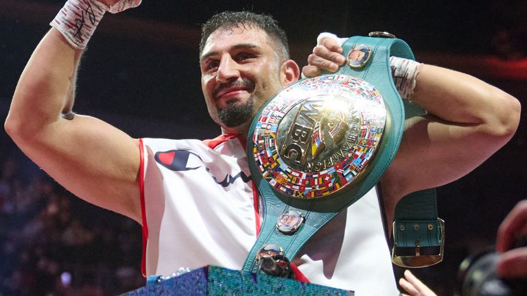 Agit Kabayel celebrates retaining the WBC interim world heavyweight title belt