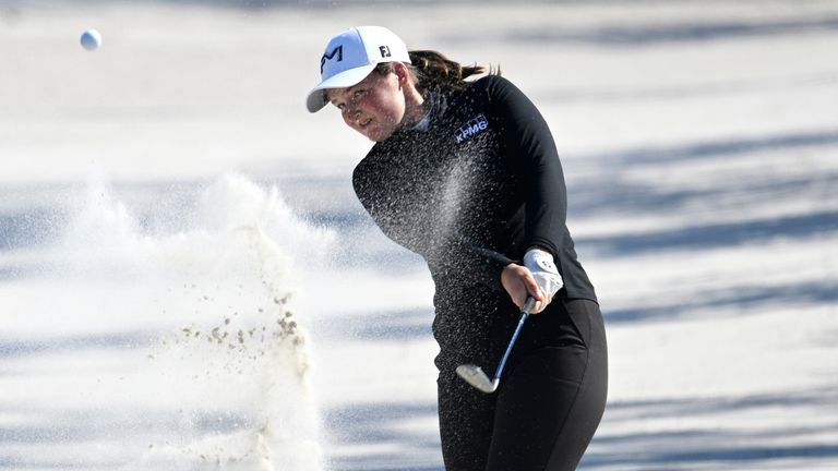 Lottie Woad of England, hits out of a bunker alongside the 18th fairway during the first round of the Tournament of Champions LPGA golf tournament, Thursday, Jan. 29, 2026, in Orlando, Fla. (AP Photo/Phelan M. Ebenhack)