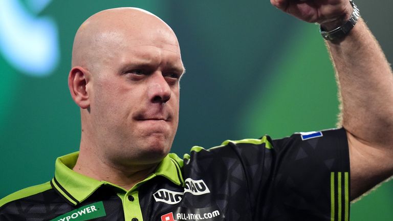 Michael van Gerwen celebrates after defeating Germany's Arno Merk at the World Darts Championship