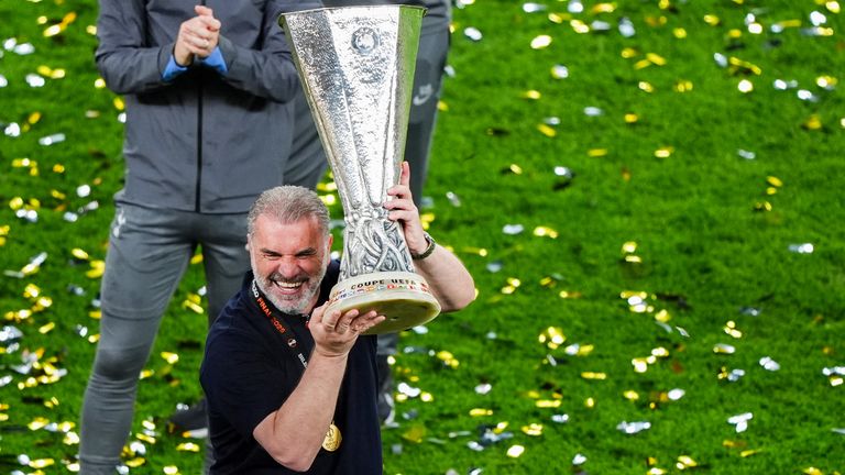 Ange Postecoglou lifts the Europa League trophy after Tottenham's win over Man Utd