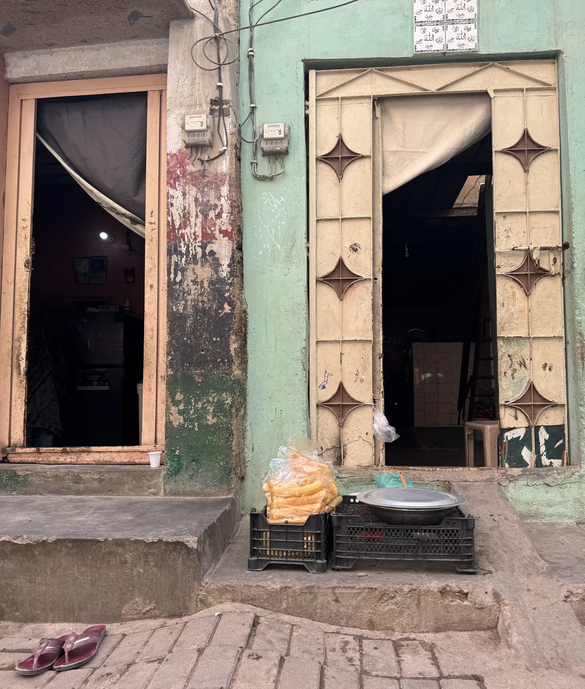 Food is ready to be sold at a doorstep in Lyari.