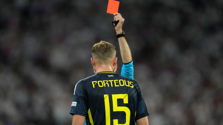 Scotland's Ryan Porteous is shown a red card by referee Clement Turpin after a challenge on Germany's Ilkay Gundogan during a Group A match between Germany and Scotland at the Euro 2024 soccer tournament in Munich, Germany, Friday, June 14, 2024. (AP Photo/Matthias Schrader)