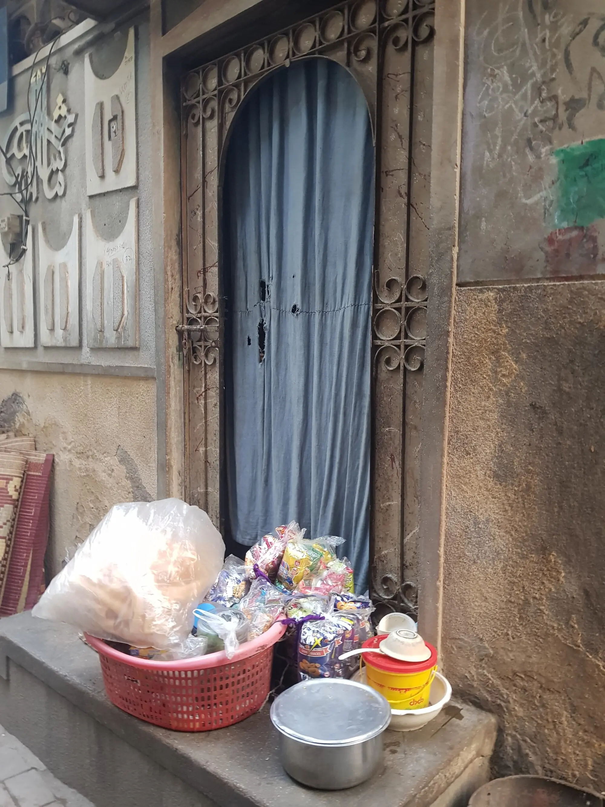 Supplies sit on the doorstep of a house in Lyari, waiting to be sold.