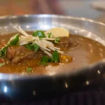 Lily Allen performs in dress printed with David Harbour purchase receipts on West End Girl tour