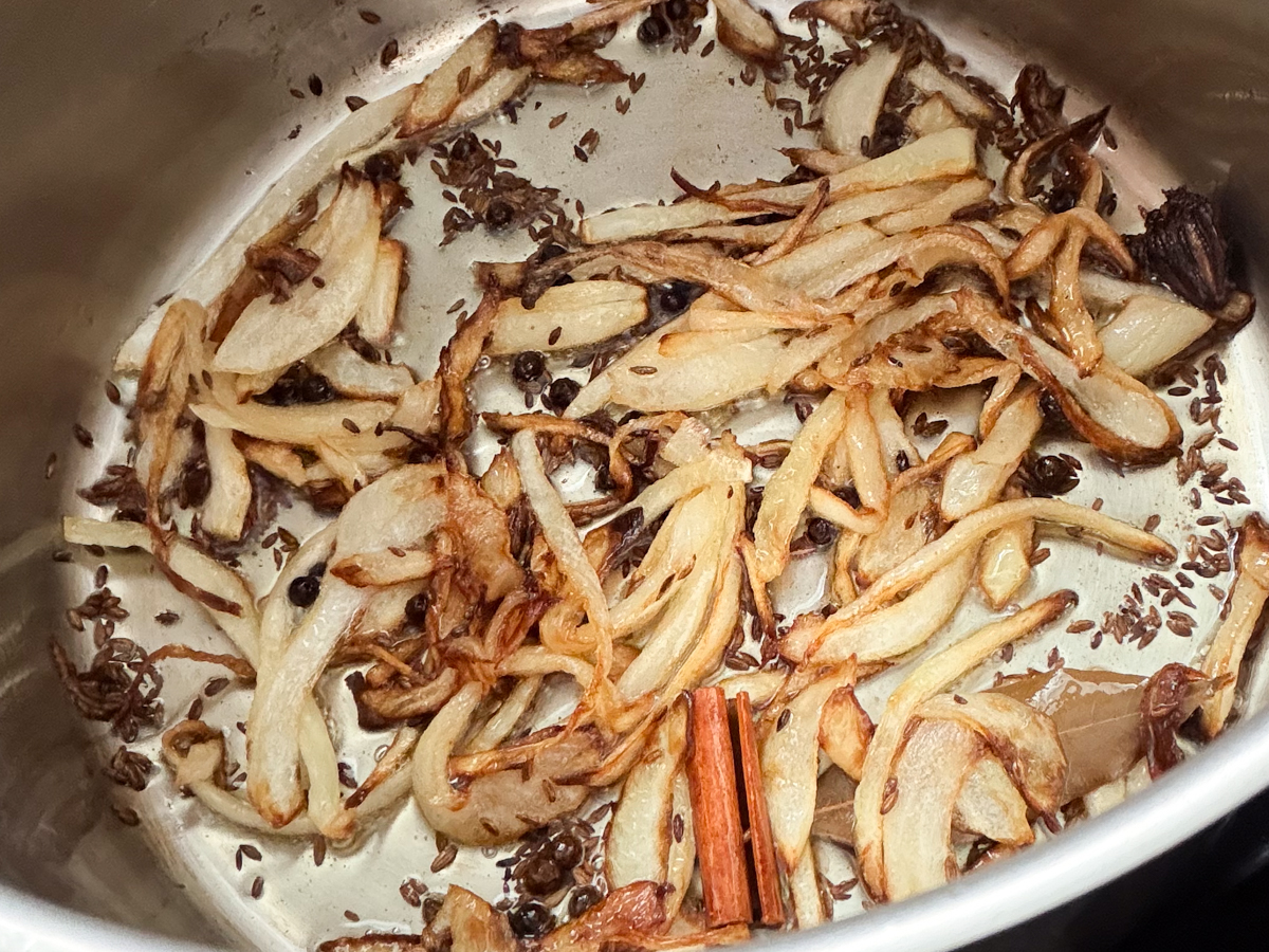 Browned onions over whole spices 