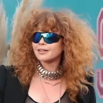 'Sartorial diplomacy' on show in expo of late UK queen's fashion