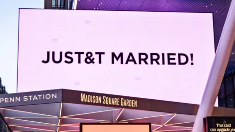 EPA Madison Square Garden is lit in pink and displays a sign reading 'JUST&T MARRIED' during Taylor Swift and Travis Kelce's wedding celebration in New York, New York, USA, 3 July 2026.